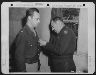 Awards > Colonel Luber, Attached To Hdq., 1St Bomb Division, Is Presented An Award By Major General Robert B. Williams During A Ceremony On 25 June 1944 At An 8Th Air Force Base In England.