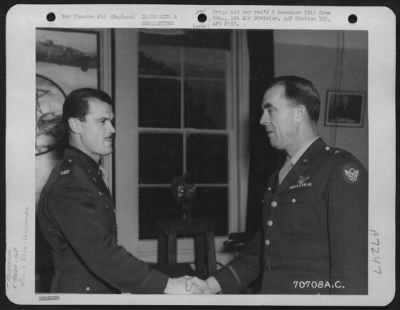 Awards > Colonel Mcdonald, Attached To Hdq., 1St Bomb Division, Is Congratulated By Major General Howard M. Turner After He Has Been Presented An Award During A Ceremony At An 8Th Air Force Base In England On 7 November 1944.