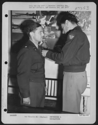 Awards > Colonel Laidlaw, Attached To Hdq., 1St Bomb Division, Receives An Award From Brig. General Bartlett Beaman During A Ceremony On 22 May 1945 At An 8Th Air Force Base In England.