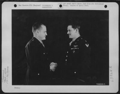 Awards > Colonel Edward J. Timberlake Congratulates Major Caldwell Of The 389Th Bomb Group After Presenting Him With The Distinguished Service Cross At An 8Th Air Force Base In England.