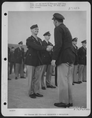 Thumbnail for Awards > Capt. Stressing Of The 390Th Bomb Group Is Congratulated After Receiving The Distinguished Flying Cross During A Ceremony At An Air Base Somewhere In England.  30 July 1944.