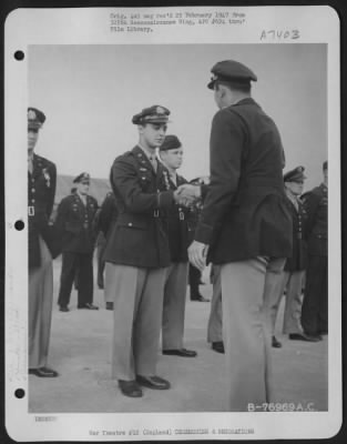 Thumbnail for Awards > Lt. Clapp Of The 390Th Bomb Group Is Congratulated After Receiving The Distinguished Flying Cross During A Ceremony At An Air Base Somewhere In England.  30 July 1944.