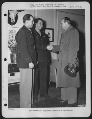 Awards > Colonel G.W. Towle, Clinton, Iowa, Chief Of Staff Of The 8Th Air Force (Right) Congratulating (Left To Right) 2Nd Lt. Gene B. Fetrow, Upton, Calif, And 2Nd Lt. Frank J. Smolinsky, New York City, N.Y. After Presenting The Air Medal To Each For Downing A Fo