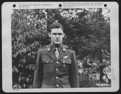 Awards > A Member Attached To Hdq., 1St Bomb Division, Poses For The Photographer After Receiving The Distinguished Flying Cross During A Ceremony Somewhere In England.  21 August 1943.