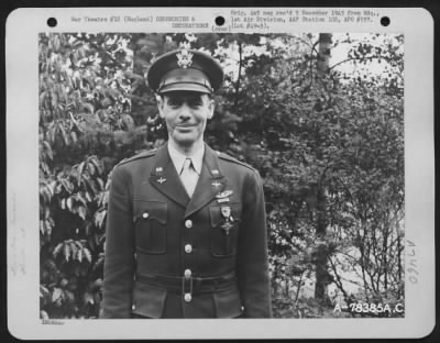 Awards > A Member Attached To Hdq., 1St Bomb Division, Poses For The Photographer After Receiving The Distinguished Flying Cross At An Air Base Somewhere In England.  21 August 1943.