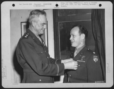 Thumbnail for Awards > Colonel Crouch Of The 9Th Troop Carrier Command Is Presented The Legion Of Merit By Major General Paul L. Williams During A Ceremony At An Airbase Somewhere In England.  9 January 1945.