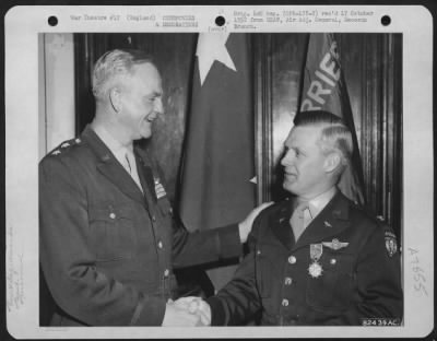 Awards > Colonel Harry W. Generous Is Congratulated By Major General Paul L. Williams Of The 9Th Troop Carrier Command, During A Ceremony Somewhere In England.  2 June 1945.