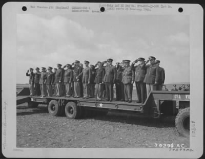 Thumbnail for Inspections & Reviews > As The Colors Pass In Review, Various Members Of The United Nations Armies And Air Corps Are Seen Standing At Attention And Saluting The American Flag During Ceremonies At The Opening Of A New Airport At Nuthampstead, England On 17 June 1943.