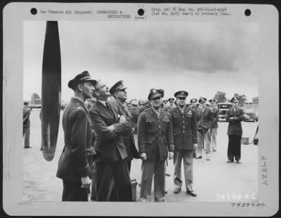 Thumbnail for Inspections & Reviews > An Off Guard Shot At A Recent Inspection Of A U.S.A.F. Base In Snedton Heath, England.  Left To Right: Capt. Robert E. Miller, Pleasant Ridge, Mich., Pilot Of The "Fascinating Witch", Mr. Anthony Edend, And Lt. Gen. Jacob L. Devers, Cg Eto.  June 1943.