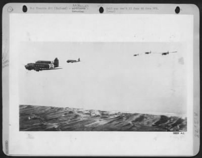 General > American gliders, loaded with U.S. Army Infantryman, and towed by Douglas C-47's of the 9th AF Troop Carrier Command are seen over the coast of France, just after completing the trip across the English Channel. These planes, part of the greatest