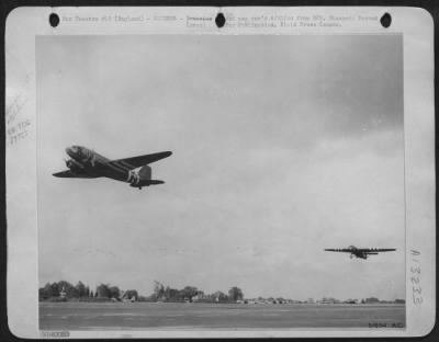 General > NINTH AIR force TROOP CARRIER COMMAND STATION, England--A Douglas C-47 transport towing a glider load of Yank airborne infantry is shown taking off from a Ninth Air force Troop Carrier Command station as additional troops pour into France