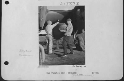 Thumbnail for General > EIGHTH AAF SERVICE COMMAND STATION-One of the new jettisonable auxiliary gasoline tanks is shown prior to being installed on a Lockheed Lightning. This modification, which is being done by Eighth AAF Service Command technicians, is one of the reasons