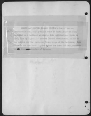Thumbnail for General > EIGHTH AAF SERVICE COMMAND STATION-One of the new jettisonable auxiliary gasoline tanks is shown prior to being installed on a Lockheed Lightning. This modification, which is being done by Eighth AAF Service Command technicians, is one of the reasons
