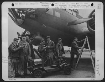 Thumbnail for General > U.S. AIR force PHOTO The electrical apparatus of a Flying ofrtress is checked with instruments of the "creep"-a hand-made miniature truck built by (left to right) Cpl. Charles E. Codyer, Waltham, Mass., T/Sgt. Gerald Rothermel, McLean