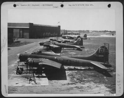 Thumbnail for General > Overall shot from the control tower overlooking a section of 8th Air force field where Boeing B-17 Flying ofrtresses are under repair.