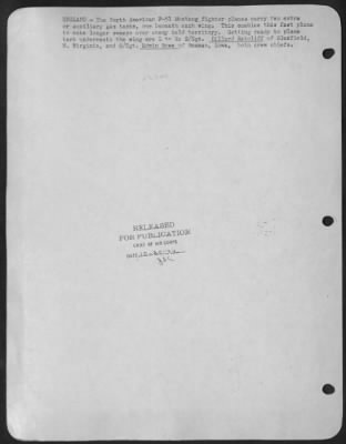 Thumbnail for General > ENGLAND-The North American P-51 Mustang fighter planes carry two extra or auxiliary gas tanks, one beneath each wing. This enables this fast plane to make longer sweeps over enemy held territory. Getting ready place tank underneath the wing are