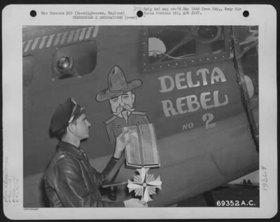 Thumbnail for Miscellaneous > Captain Birdsong Puts The Distinguished Flying Cross On The Boeing B-17 "Flying Fortress" "Delta Rebel No. 2" For Its Part In Wrecking Nazi Installations In Europe.  The Plane Is Attached To The 91St Bomb Group Based In Bassingbourne, England.  8 June 194