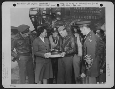 Thumbnail for Miscellaneous > Capt. Walter Stewart, Salt Lake City, Utah, Pilot Of The Consoldiated B-24 'Liberator' Bomber, 'Bomerang' Which Has Completed 53 Missions In The European Theatre Of Operations, Receives A Cake From Miss Rachel Homer, American Red Cross Worker, Prior To De