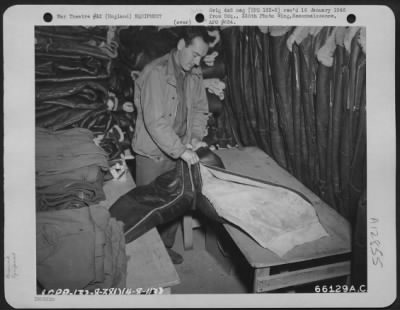 General > Sgt. Garvey Stores Flying Suits In An Equipment Room Of The 381St Bomb Group, England.  4 August 1944.