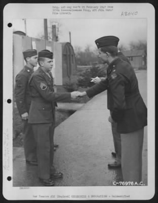 Thumbnail for Unidentified > A Member Of The 569Th Bomb Squadron, 390Th Bomb Group, Is Congratulated After Receiving An Award During A Ceremony At An Air Base In England.  23 February 1944.