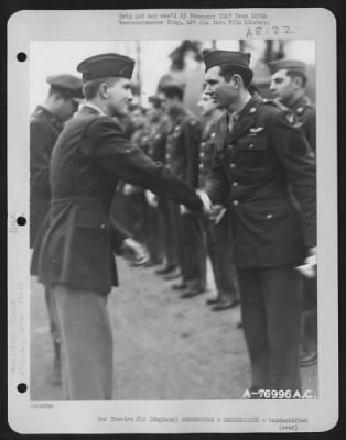 Thumbnail for Unidentified > A Member Of The 569Th Bomb Squadron, 390Th Bomb Group Is Congratulated After Receiving An Award During A Ceremony At An Air Base Somewhere In England.  22 January 1944.