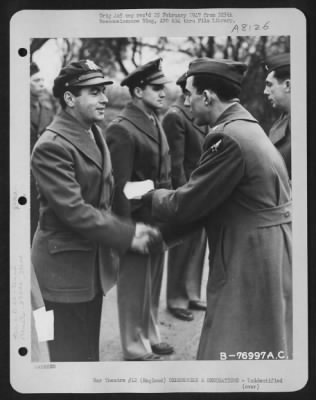 Thumbnail for Unidentified > A Member Of The 570Th Bomb Squadron, 390Th Bomb Group Is Congratulated After Receiving An Award During A Ceremony At An Air Base Somewhere In England.  9 January 1944.