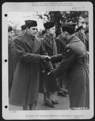 Thumbnail for Unidentified > A Member Of The 570Th Bomb Squadron, 390Th Bomb Group Is Congratulated After Receiving An Award During A Ceremony At An Air Base Somewhere In England.  9 January 1944.