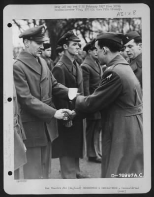 Thumbnail for Unidentified > A Member Of The 570Th Bomb Squadron, 390Th Bomb Group Is Congratulated After Receiving An Award During A Ceremony At An Air Base Somewhere In England.  9 January 1944.