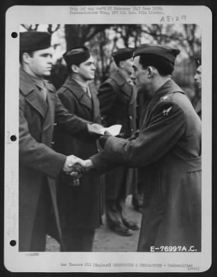 Thumbnail for Unidentified > A Member Of The 570Th Bomb Squadron, 390Th Bomb Group Is Congratulated After Receiving An Award During A Ceremony At An Air Base Somewhere In England.  9 January 1944.