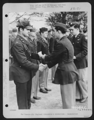 Thumbnail for Unidentified > A Member Of The 570Th Bomb Squadron, 390Th Bomb Group Is Congratulated After Receiving An Award During A Ceremony At An Air Base Somewhere In England.  28 January 1944.