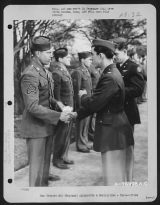 Thumbnail for Unidentified > A Member Of The 570Th Bomb Squadron, 390Th Bomb Group Is Congratulated After Receiving An Award During A Ceremony At An Air Base Somewhere In England.  28 January 1944.