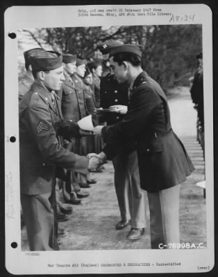 Thumbnail for Unidentified > A Member Of The 570Th Bomb Squadron, 390Th Bomb Group Is Congratulated After Receiving An Award During A Ceremony At An Air Base Somewhere In England.  28 January 1944.