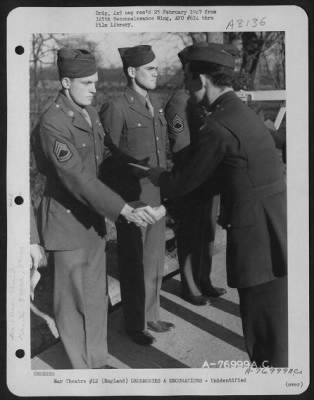 Thumbnail for Unidentified > A Member Of The 570Th Bomb Squadron, 390Th Bomb Group Is Congratulated After Receiving An Award During A Ceremony At An Air Base Somewhere In England.  1 March 1944.