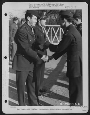 Thumbnail for Unidentified > A Member Of The 570Th Bomb Squadron, 390Th Bomb Group Is Congratulated After Receiving An Award During A Ceremony At An Air Base Somewhere In England.  1 March 1944.