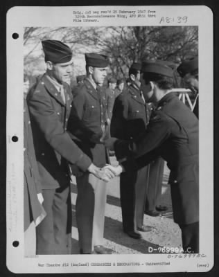 Thumbnail for Unidentified > A Member Of The 570Th Bomb Squadron, 390Th Bomb Group Is Congratulated After Receiving An Award During A Ceremony At An Air Base Somewhere In England.  1 March 1944.