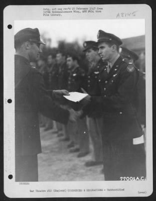 Thumbnail for Unidentified > A Member Of The 571St Bomb Squadron, 390Th Bomb Group Is Congratulated After Receiving An Award During A Ceremony At An Air Base Somewhere In England.  28 January 1944.