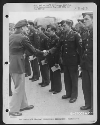 Thumbnail for Unidentified > A Member Of The 571St Bomb Squadron, 390Th Bomb Group Is Congratulated After Receiving An Award During A Ceremony At An Air Base Somewhere In England.  11 March 1944.