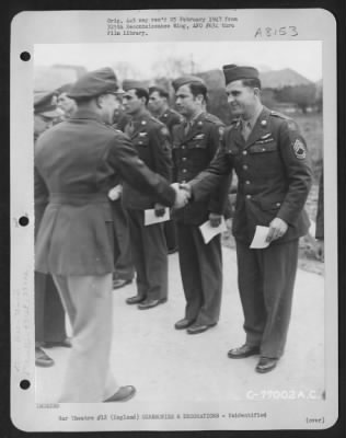 Thumbnail for Unidentified > A Member Of The 571St Bomb Squadron, 390Th Bomb Group Is Congratulated After Receiving An Award During A Ceremony At An Air Base Somewhere In England.  11 March 1944.