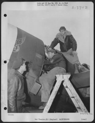 Thumbnail for Engines > While Pfc. Michael Biagi Of Memphis, Tenn., Works On The Motor Of A Republic P-47 At The Warrington Burtonwood Air Depot In England, 1St Lt. Bancroft Johnson, Left, A Test Pilot, And 1St Lt. Aaron Z. Bessant, On Top Of Plane, Also A Test Pilot, Discuss Th