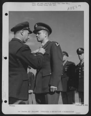 Thumbnail for Unidentified > An Officer Presents The Air Medal To A Member Of The 314Th Service Group Of The 364Th Fighter Group During A Ceremony At An Airbase Somewhere In England.  25 May 1944.