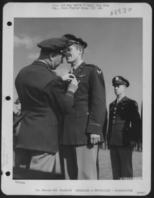 Thumbnail for Unidentified > An Officer Presents The Air Medal To A Member Of The 314Th Service Group Of The 364Th Fighter Group During A Ceremony At An Airbase Somewhere In England.  25 May 1944.