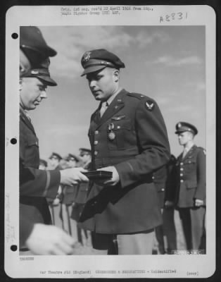 Thumbnail for Unidentified > An Officer Presents The Air Medal To A Member Of The 314Th Service Group Of The 364Th Fighter Group During A Ceremony At An Airbase Somewhere In England.  25 May 1944.