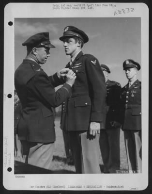 Thumbnail for Unidentified > An Officer Presents The Air Medal To A Member Of The 314Th Service Group Of The 364Th Fighter Group During A Ceremony At An Airbase Somewhere In England.  25 May 1944.