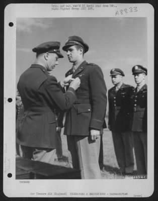 Thumbnail for Unidentified > An Officer Presents The Air Medal To A Member Of The 314Th Service Group Of The 364Th Fighter Group During A Ceremony At An Airbase Somewhere In England.  25 May 1944.