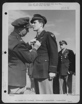 Thumbnail for Unidentified > An Officer Presents The Air Medal To A Member Of The 314Th Service Group Of The 364Th Fighter Group During A Ceremony At An Airbase Somewhere In England.  25 May 1944.