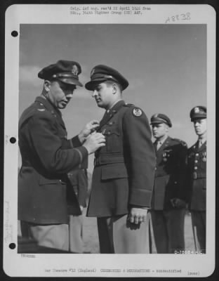 Thumbnail for Unidentified > An Officer Presents The Air Medal To A Member Of The 314Th Service Group Of The 364Th Fighter Group During A Ceremony At An Airbase Somewhere In England.  25 May 1944.