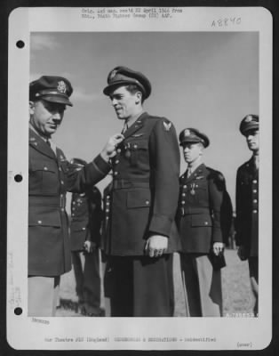 Thumbnail for Unidentified > An Officer Presents The Air Medal To A Member Of The 314Th Service Group Of The 364Th Fighter Group During A Ceremony At An Airbase Somewhere In England.  25 May 1944.