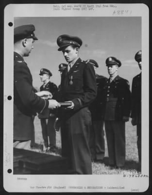 Thumbnail for Unidentified > An Officer Presents The Air Medal To A Member Of The 314Th Service Group Of The 364Th Fighter Group During A Ceremony At An Airbase Somewhere In England.  25 May 1944.