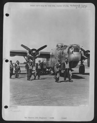 Thumbnail for Consolidated > Capt. Howard W. Slaton, pilot of a B-24 Liberator, shown leading his crew off the field in England after a mission over Berlin. Capt. Slaton is from Courtland, Ala. (Kodachrome #2389 & A).