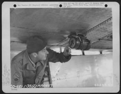 Thumbnail for Consolidated > T/Sgt. Wheeler Of Detachment 'A' 881St Chemical Company, Examines Installation Of Smoke Generator (British) On A Boeing B-17 "Flying Fortress" Of The 381St Bomb Group.  England, 1 April 1945.